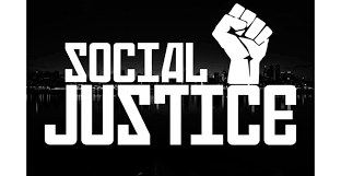 "Social Justice" written in white letters and a clenched fist overlaid on an image of a city at night